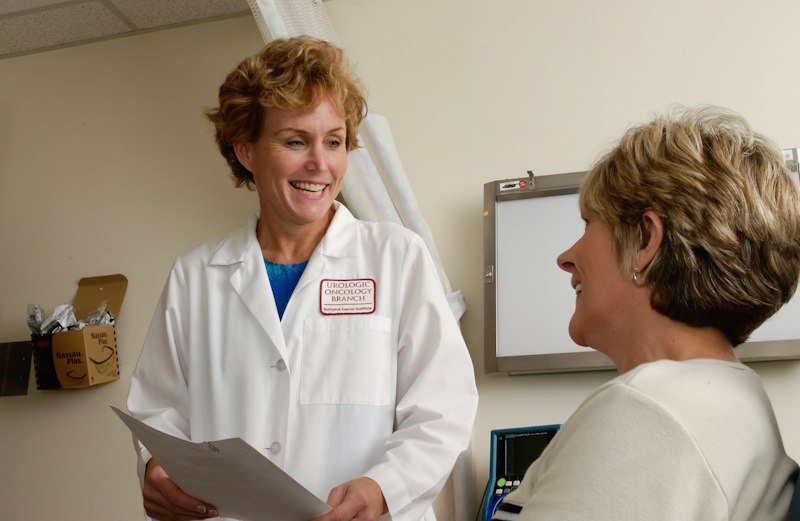 Compassionate pediatrician examining a happy child