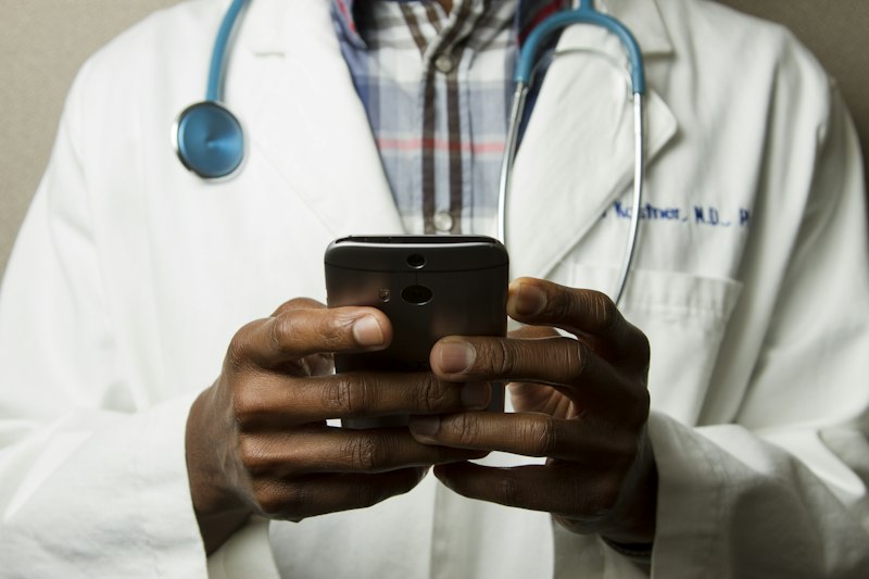 Doctor reviewing online medical records on a tablet